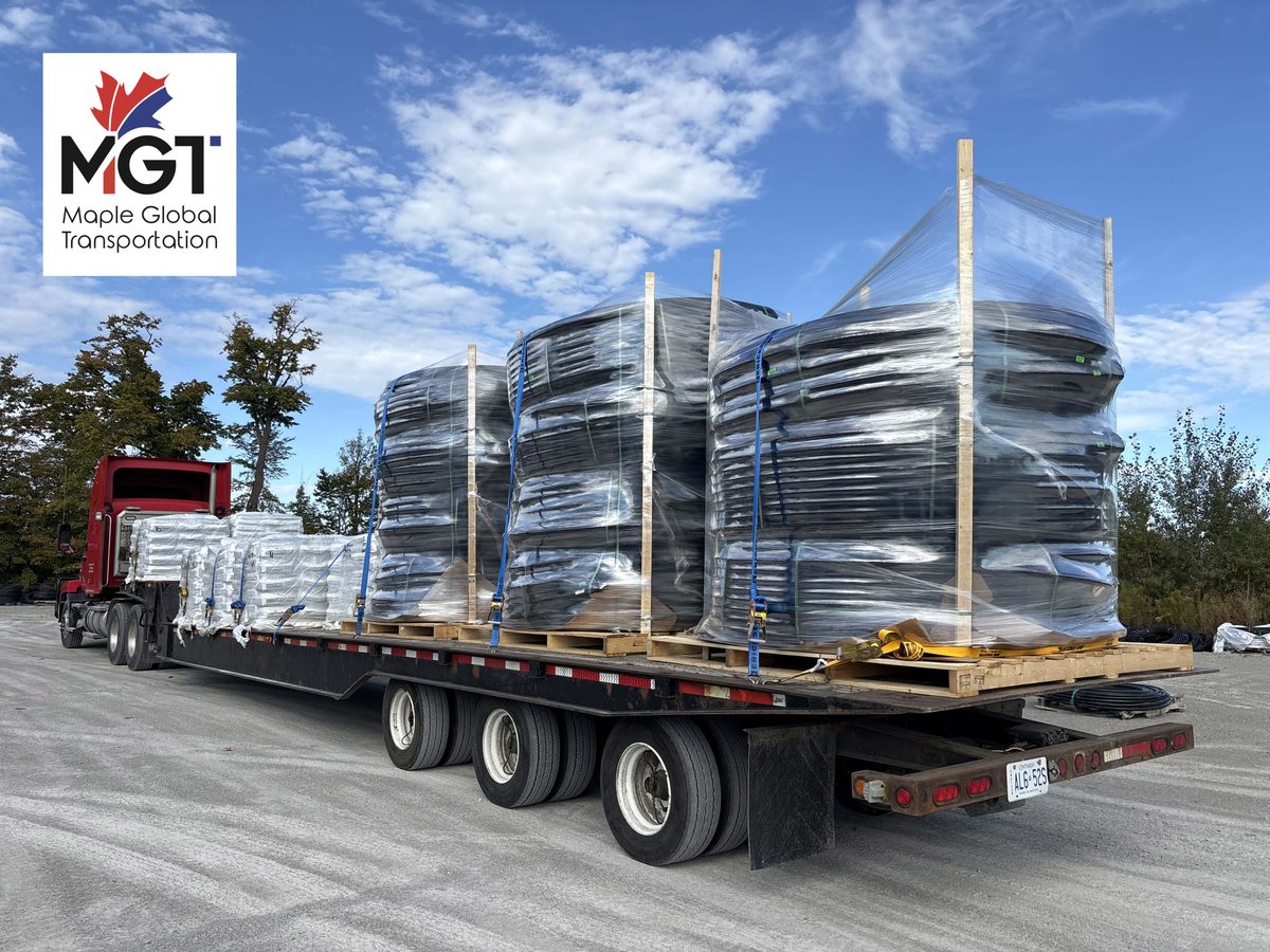 MGT flatbed truck delivering construction materials in Ontario